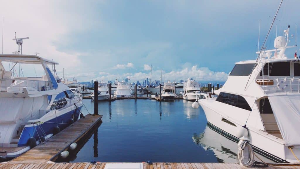 white boat on dock during daytime